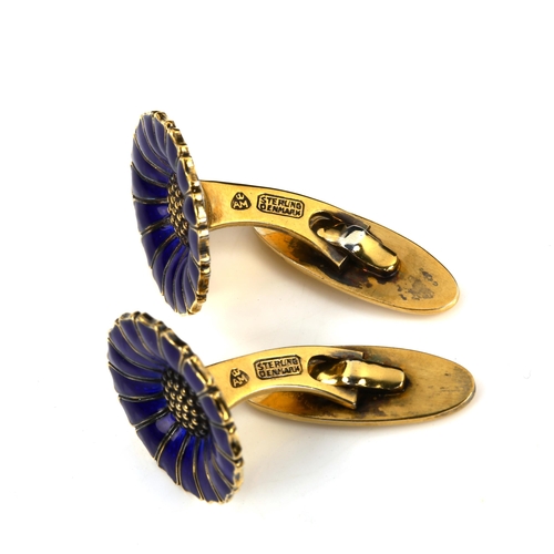 503 - ANTON MICHELSEN - a pair of Danish vermeil sterling silver and blue enamel daisy pattern cufflinks, ... 