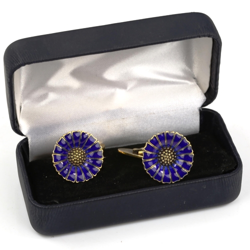 503 - ANTON MICHELSEN - a pair of Danish vermeil sterling silver and blue enamel daisy pattern cufflinks, ... 