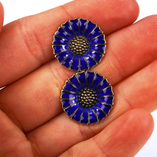 503 - ANTON MICHELSEN - a pair of Danish vermeil sterling silver and blue enamel daisy pattern cufflinks, ... 