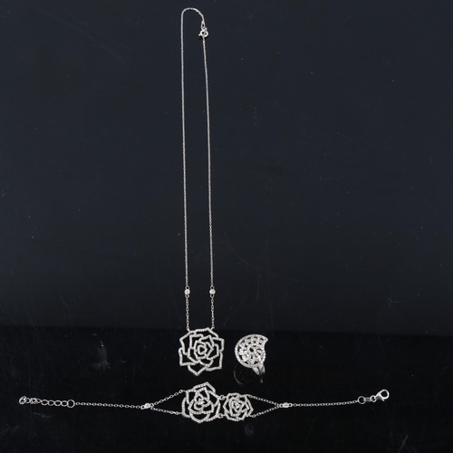 517 - A modern sterling silver and cubic zirconia demi-parure, comprising pendant necklace, bracelet and r... 