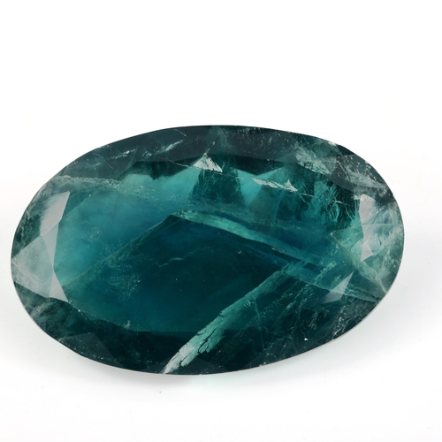 520 - An unmounted 255.7ct oval mixed-cut green fluorite, 55.00mm x 34.00mm x 18.20mm, 51.1g, with GLI rep... 