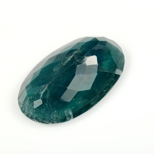 520 - An unmounted 255.7ct oval mixed-cut green fluorite, 55.00mm x 34.00mm x 18.20mm, 51.1g, with GLI rep... 