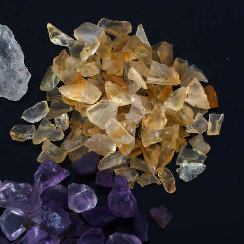 527 - A quantity of unmounted rough gemstones, including amethyst, lemon quartz and citrine