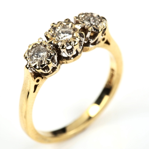 535 - A modern 9ct gold three stone diamond ring, illusion set with modern round brilliant-cut diamonds, t... 