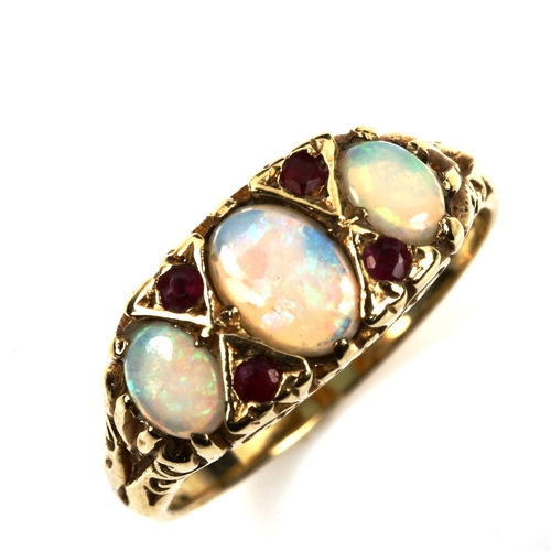 538 - A 9ct gold seven stone opal and ruby half hoop ring, set with oval cabochon opal and round-cut ruby,... 