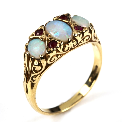 538 - A 9ct gold seven stone opal and ruby half hoop ring, set with oval cabochon opal and round-cut ruby,... 