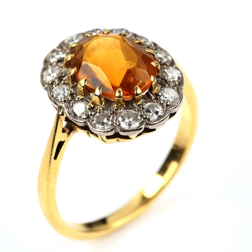 542 - An 18ct gold citrine and diamond oval cluster ring, set with oval mixed-cut citrine and modern round... 