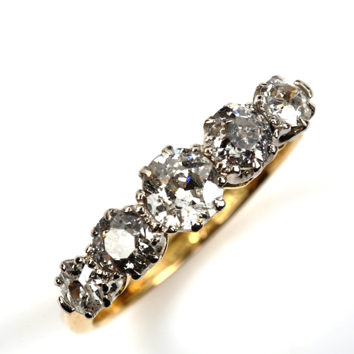 544 - An 18ct gold graduated five stone diamond ring, set with old European-cut diamonds, total diamond co... 