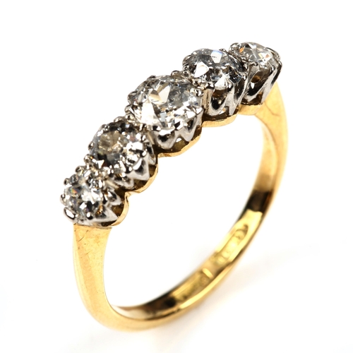 544 - An 18ct gold graduated five stone diamond ring, set with old European-cut diamonds, total diamond co... 