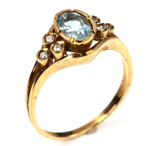 547 - A modern 9ct gold blue topaz and diamond dress ring, set with oval mixed-cut topaz and modern round ... 