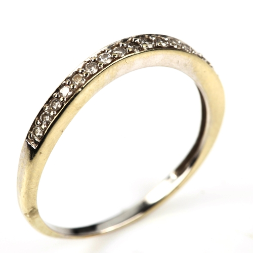 548 - An unmarked white gold diamond half eternity ring, set with modern round brilliant-cut diamonds, ban... 