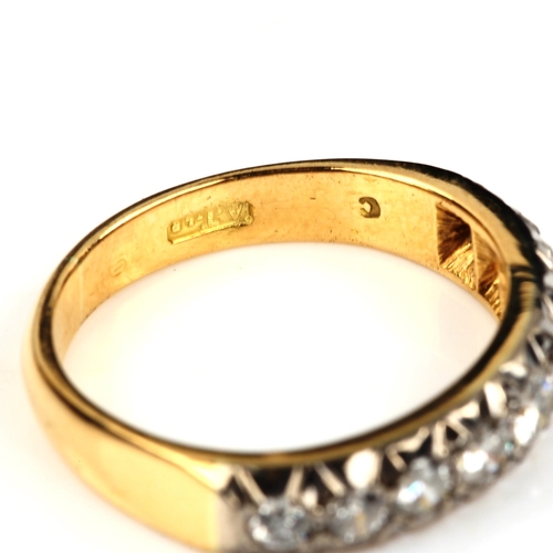 551 - An 18ct gold nine stone half eternity ring, set with modern round brilliant-cut diamonds, total diam... 