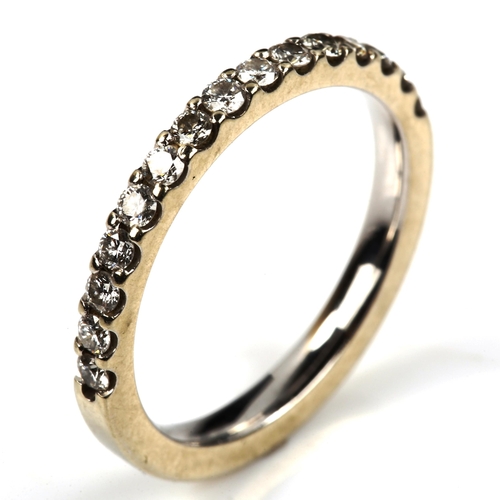 552 - A modern 18ct white gold diamond half eternity ring, set with modern round brilliant-cut diamonds, t... 