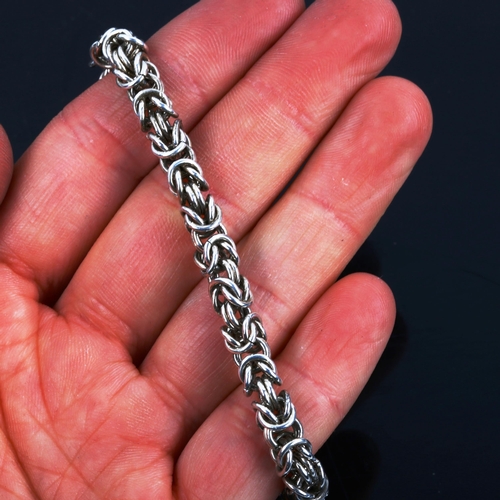 568 - 3 Danish silver Viking Revival birdcage link chain bracelets, all 19cm long, 64.1g total (3)