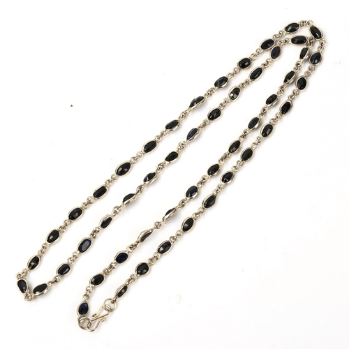 605 - A modern silver sapphire line necklace, set with oval mixed-cut sapphire, necklace length 50cm, 8.4g