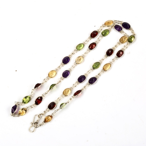 606 - A modern silver gem set line necklace, gemstones include peridot amethyst citrine and garnet, neckla... 