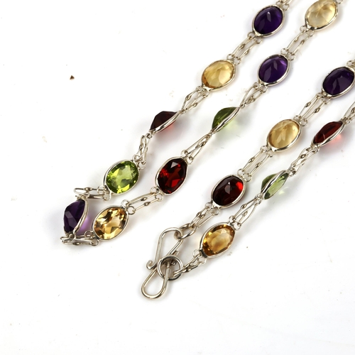 606 - A modern silver gem set line necklace, gemstones include peridot amethyst citrine and garnet, neckla... 