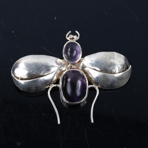 607 - A modern silver moonstone and amethyst figural bug brooch, wingspan 54mm, 9.5g