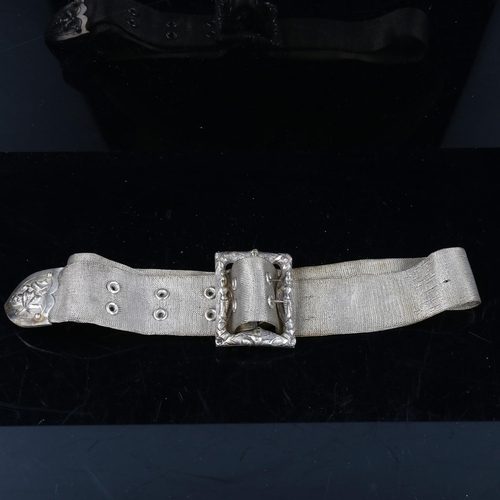 743 - An Indian unmarked silver mesh belt, with cast figural buckle and slide, length 80cm, 7.9oz