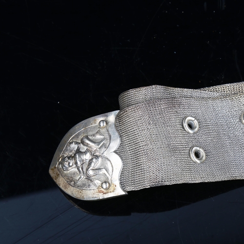 743 - An Indian unmarked silver mesh belt, with cast figural buckle and slide, length 80cm, 7.9oz