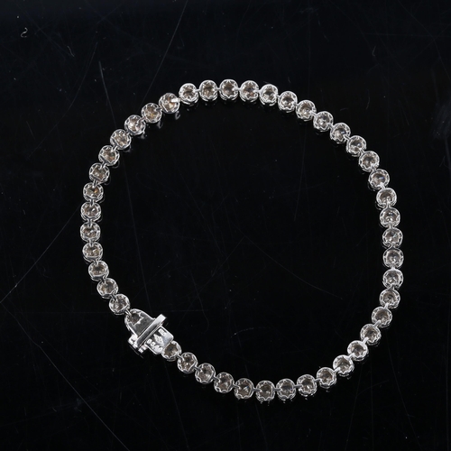 327 - A modern 18ct white gold diamond tennis line bracelet, set with modern round brilliant-cut diamonds,... 