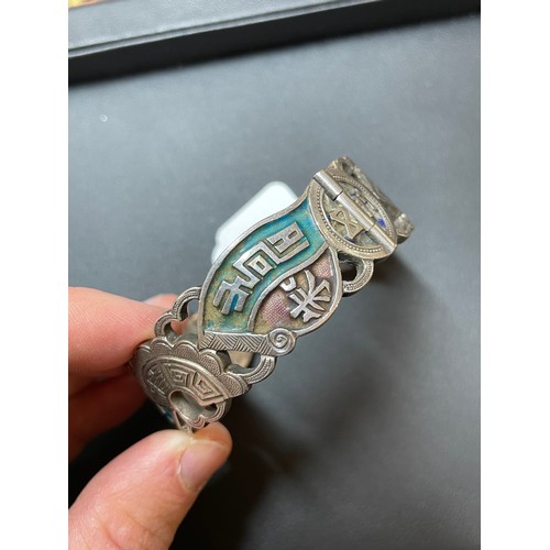 265 - A Chinese silver and enamel hinged bangle, with character mark decoration and stamped maker's mark, ... 