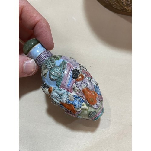 1017 - 3 Chinese snuff bottles, comprising a relief carved jade bottle with stopper, height 4.5cm, a relief... 