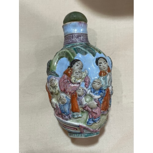 1017 - 3 Chinese snuff bottles, comprising a relief carved jade bottle with stopper, height 4.5cm, a relief... 