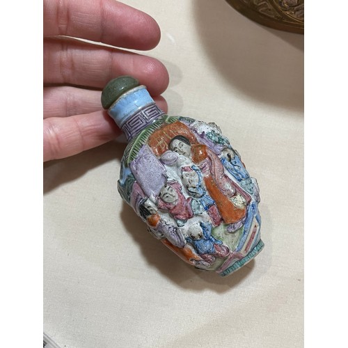 1017 - 3 Chinese snuff bottles, comprising a relief carved jade bottle with stopper, height 4.5cm, a relief... 
