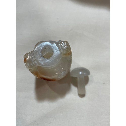 1017 - 3 Chinese snuff bottles, comprising a relief carved jade bottle with stopper, height 4.5cm, a relief... 