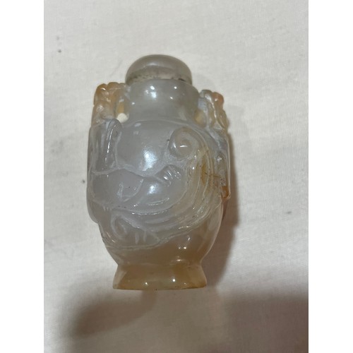 1017 - 3 Chinese snuff bottles, comprising a relief carved jade bottle with stopper, height 4.5cm, a relief... 