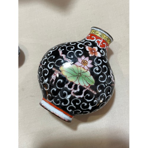 1017 - 3 Chinese snuff bottles, comprising a relief carved jade bottle with stopper, height 4.5cm, a relief... 