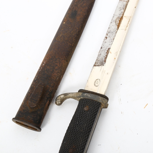 42 - A German bayonet and scabbard, blade length 20cm