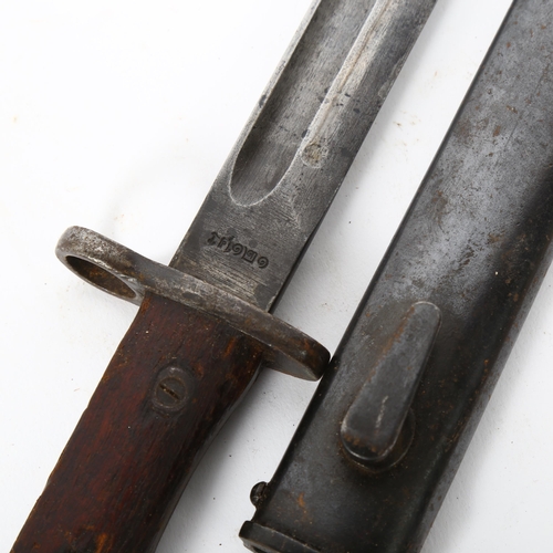 43 - A First World War Period British Army bayonet and scabbard, blade length 25cm