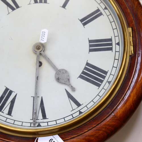 65 - An early 20th century mahogany-framed 30-hour circular dial wall clock, overall diameter 40cm, with ... 