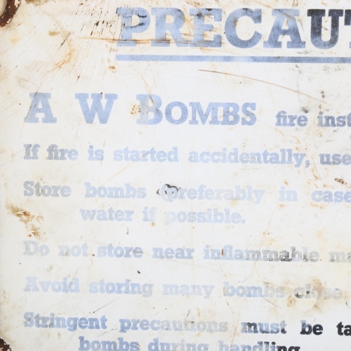 74 - A Vintage A W Bombs Precaution enamel sign, 20cm x 30cm, framed