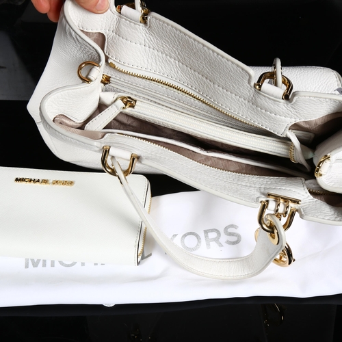 84 - MICHAEL KORS - a white leather handbag and wallet