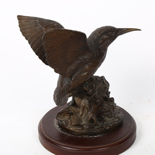 219 - A hollow cast-bronze figural sculpture, humming bird in flight, unsigned, on wood base, height 22cm