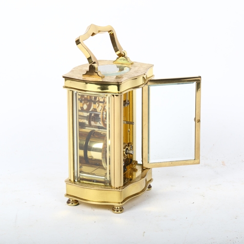 242 - A reproduction shaped brass carriage clock, by Tandridge, case height 12cm, not currently working