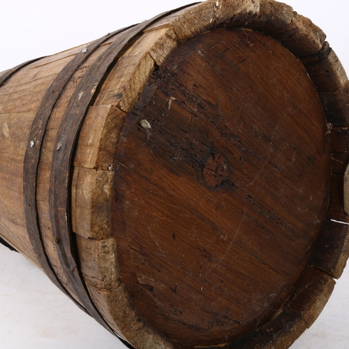 306 - A tapered coopered oak stick stand, height 50cm
