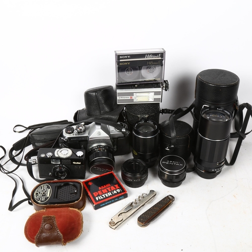 325 - A quantity of Vintage cameras and accessories, including lenses (boxful)