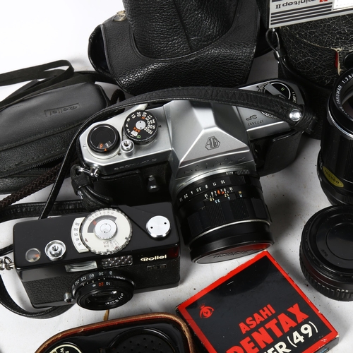 325 - A quantity of Vintage cameras and accessories, including lenses (boxful)