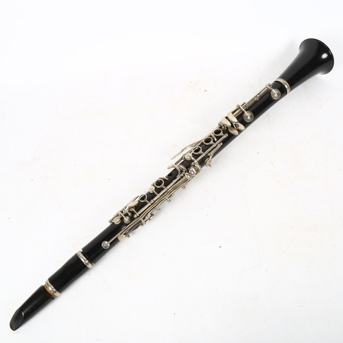 338 - A black lacquer clarinet, in fitted hardwood case