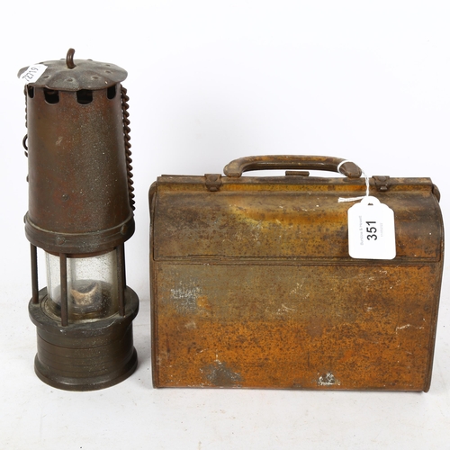 351 - A Huntley & Palmers novelty tinplate Gladstone bag biscuit tin, and a Vintage miner's oil lamp, heig... 