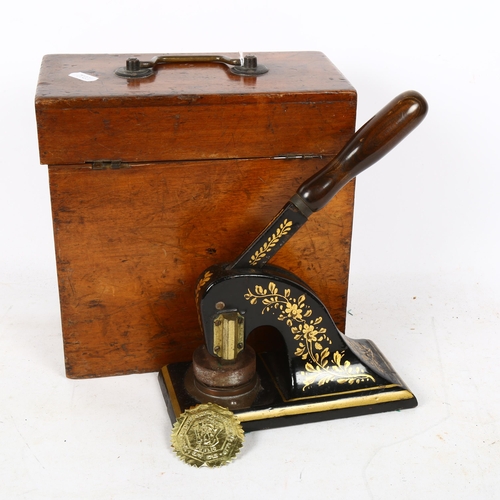 358 - A boxed gilded cast-iron paper stamp embosser