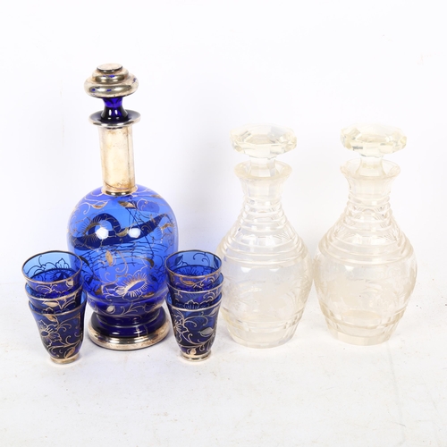 361 - A pair of etched glass decanters and stoppers, and a Venetian silver overlaid blue glass drinking se... 