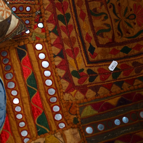 482 - Eastern embroidered throws, a scarf, cushion etc