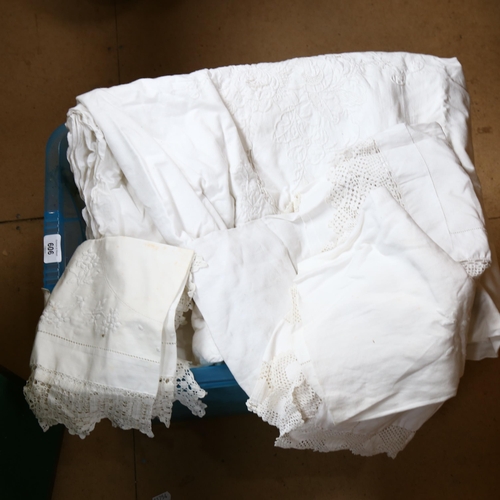 606 - An embroidered white bed cover, table cloths and other linen