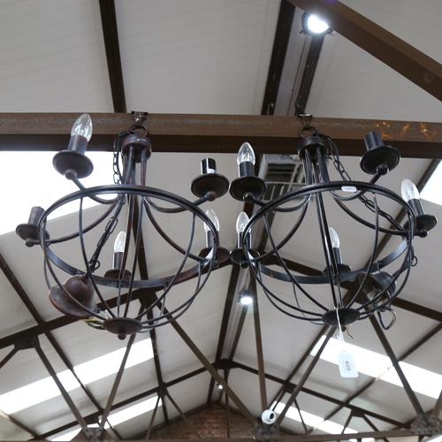 609 - A pair of wrought-metal 5-light chandeliers, 46cm diameter approx, and a brass light fitting