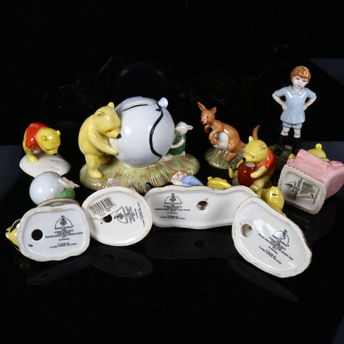 489 - A group of Royal Doulton Winnie The Pooh figures, and matching money box